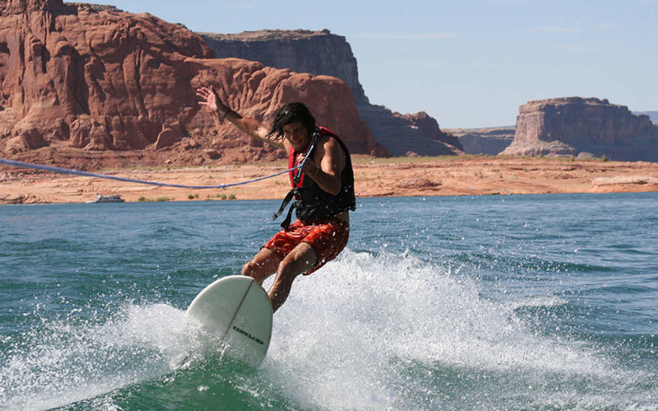Recreation Areas | Photo Gallery | 1 - Person wake surfing in Lake Powell Utah