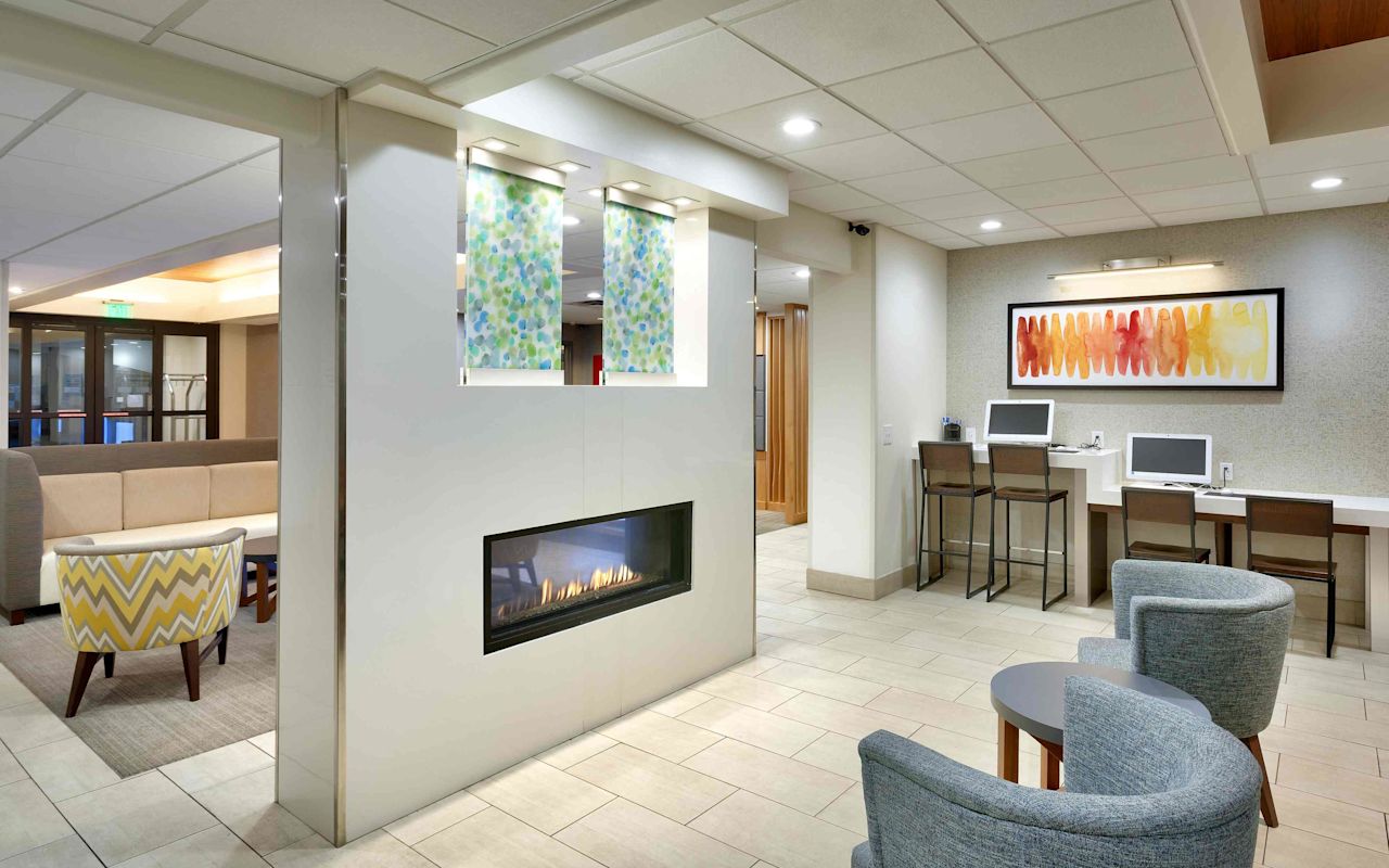 Holiday Inn Express & Suites - American Fork | Photo Gallery | 1 - Sit back and relax by the fireplace.