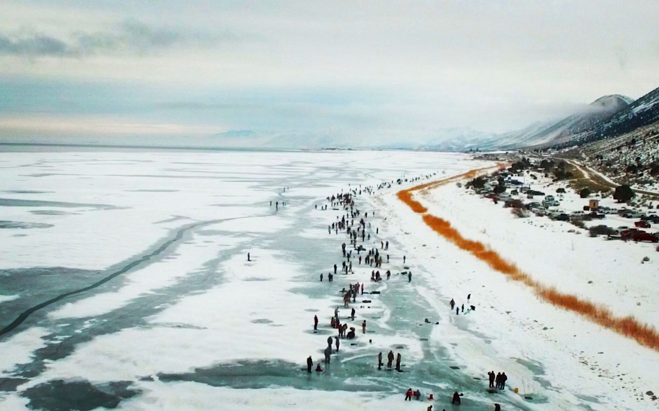 FALL IN BEAR LAKE IN WINTER | Photo Gallery | 0 - Cisco Disco Ice Fishing Holes at Bear Lake