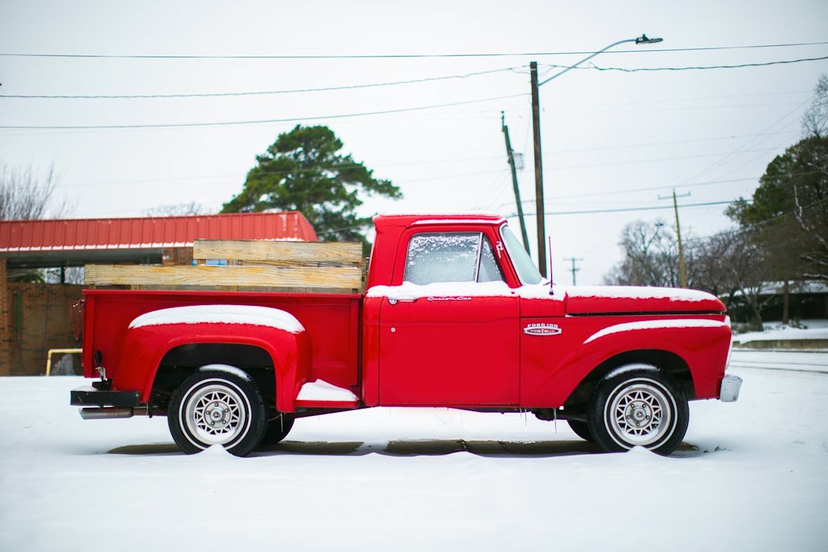 a red truck in the snow