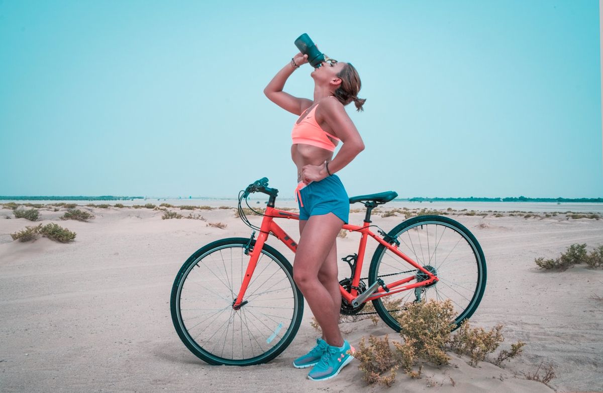 a woman riding a fitness bike