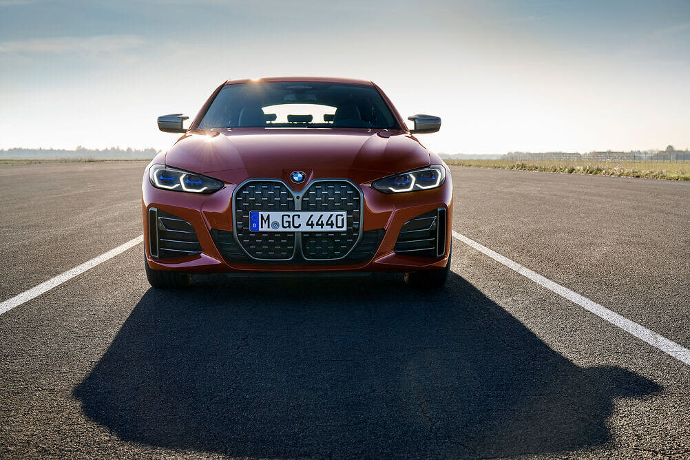 A front view of a red 2022 BMW M440i Gran Coupe