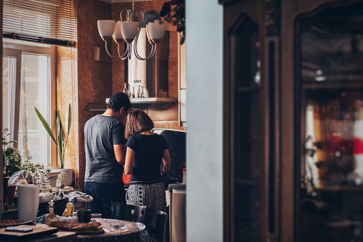 People cooking in a kitchen.