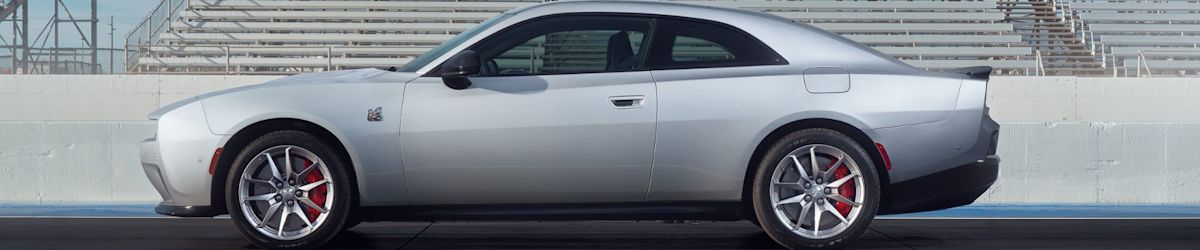 A silver Dodge Charger EV with red brake calipers