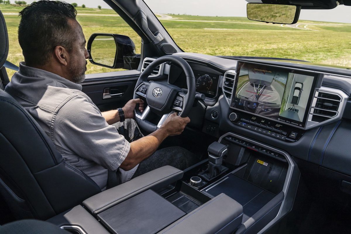 a man driving a 2022 Toyota Tundra Platinum