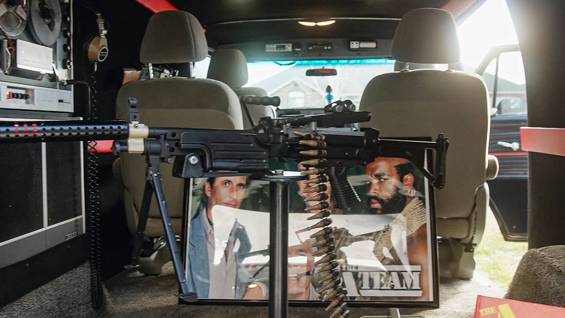 An A-Team poster, plastic toy machine gun and other props in the back of a van