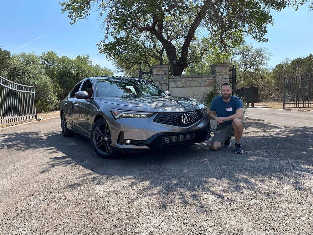 Tyson Hugie next to a 2023 Acura Integra