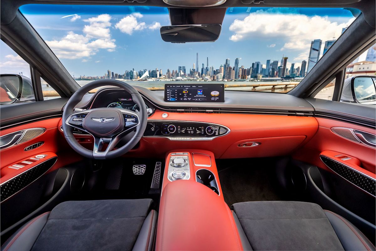 the inside of a red Genesis GV70