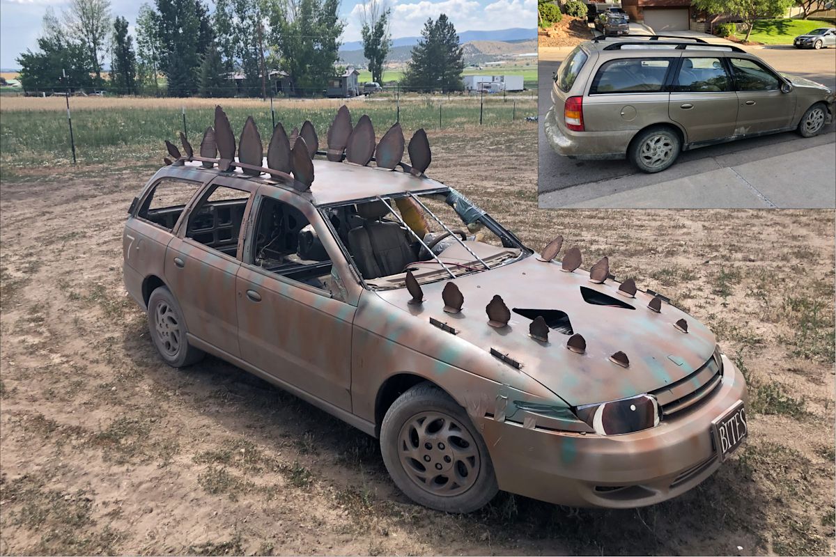 This Saturn L300 was transformed into a dinosaur car for the demolition derby that happened in Utah at the Fairview City Days in 2022.