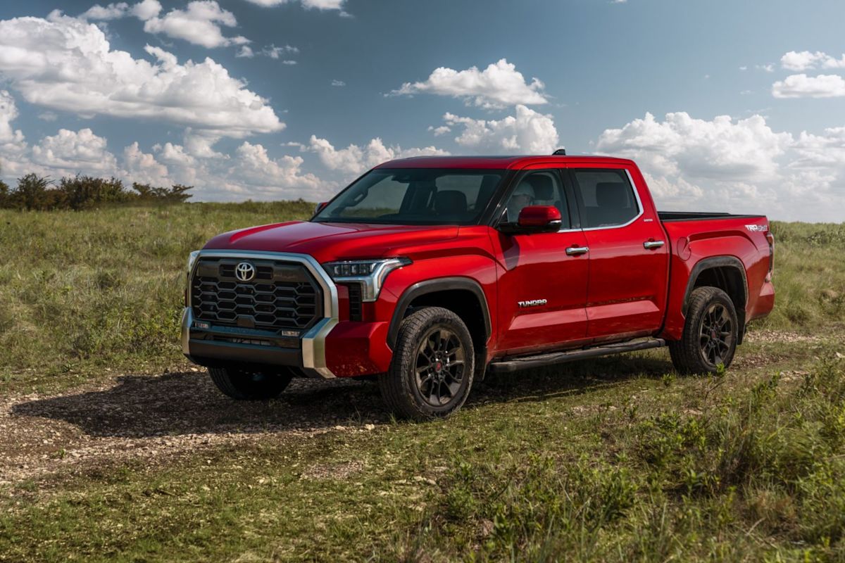 a 2022 Toyota Tundra driving down a grass road