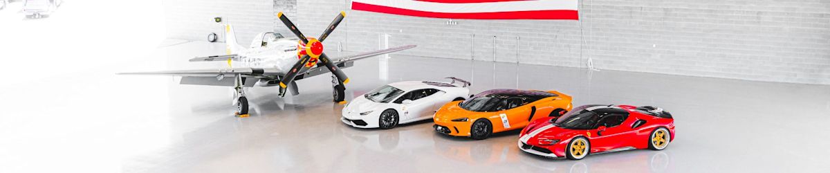 Wings and Wheels lined up in a warehouse garage