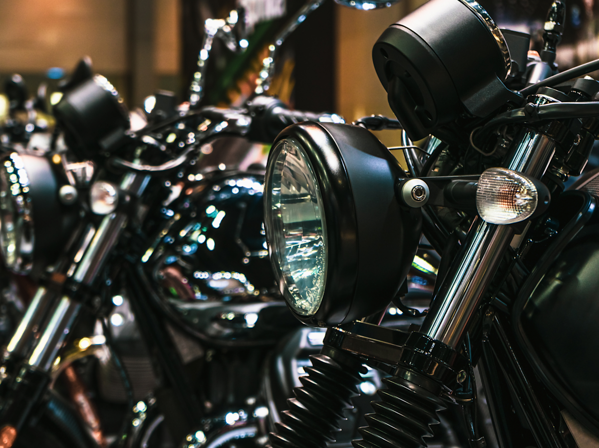 A line of motorcycles on display. 