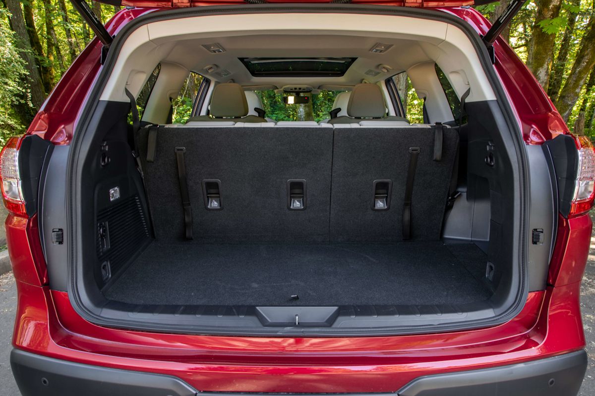 A view of the rear cargo space with the lift gate open on a crimson red Subaru Ascent